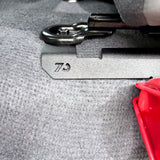 close up of fire extinguisher mounting bracket bolt placement